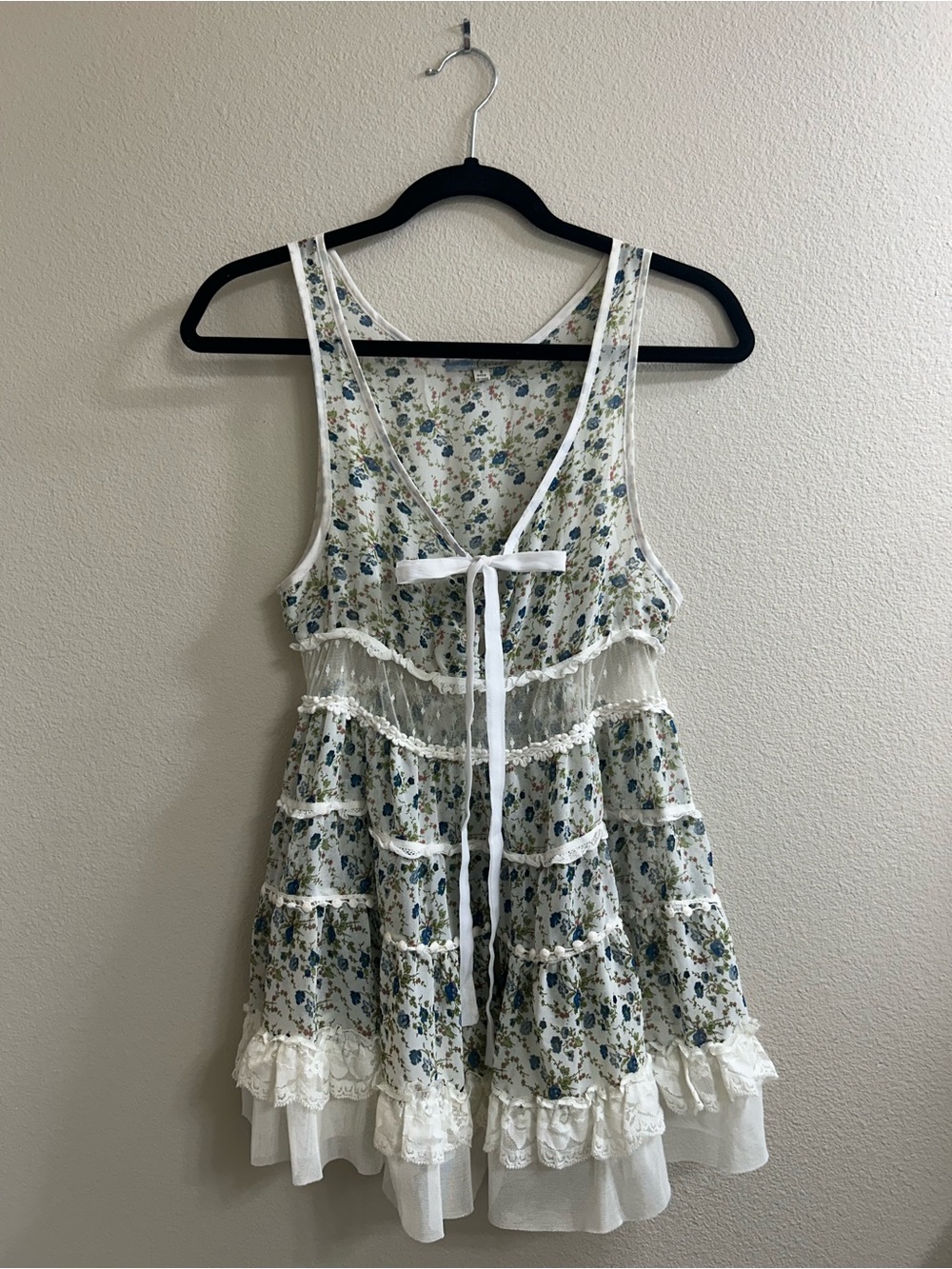 Cecico white & blue floral babydoll sleeveless top with ruffles and bow detail